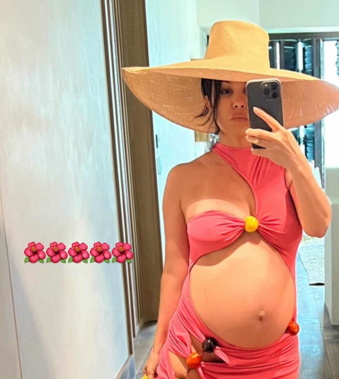 Kourtney Kardashian celebrated motherhood in orange bikini