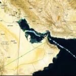 Aerial or map view of the Strait of Hormuz with oil tankers and naval ships